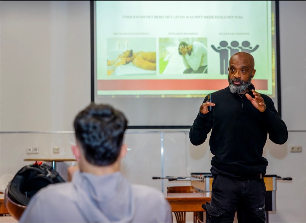 Trinity Coaching tijdens een lezing